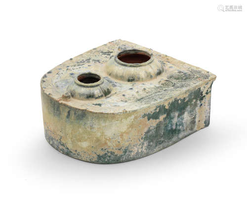 A GREEN-GLAZED POTTERY MODEL OF A STOVE Eastern Han Dynasty