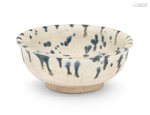 A CREAM-GLAZED BLUE-SPLASHED BOWL Tang Dynasty