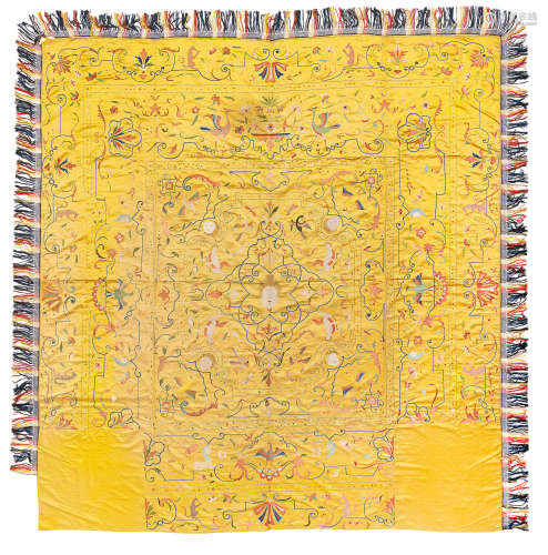 A LARGE EMBROIDERED YELLOW-GROUND SILK COVERLET FOR THE EURO...