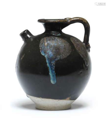 A PHOSPHATIC-SPLASHED BLACK-GLAZED EWER Tang Dynasty