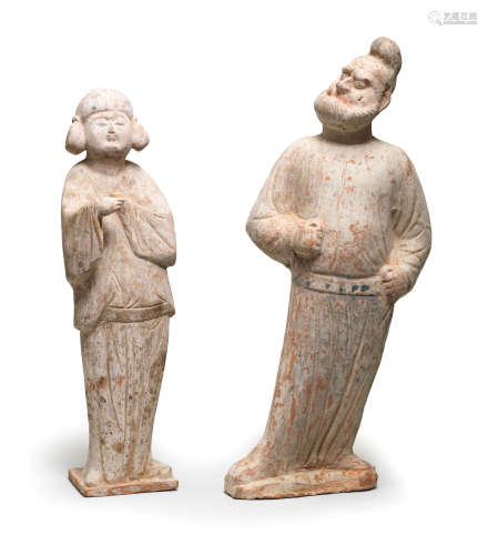 TWO PAINTED POTTERY FIGURES OF A GROOM AND A COURT LADY Tang...