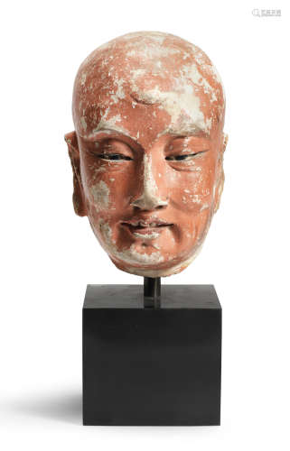 A RARE PAINTED STUCCO HEAD OF A LUOHAN 13th/15th century