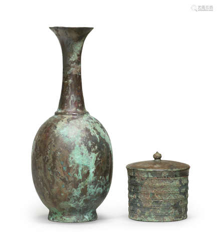 A BRONZE RIBBED BOX AND COVER AND A BRONZE BOTTLE VASE Tang ...