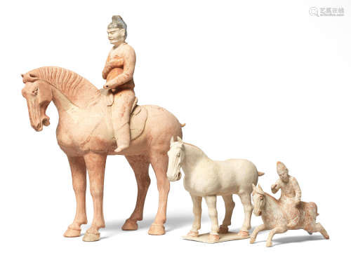 A RED POTTERY MODEL OF A HORSE AND RIDER Tang Dynasty