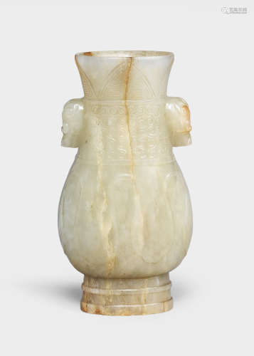 AN ARCHAISTIC PALE GREEN AND RUSSET JADE VASE, HU Yuan/Ming ...