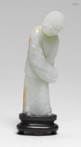 A PALE GREEN JADE CARVING OF A LUOHAN 17th century