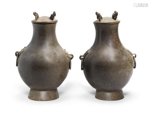 A PAIR OF BRONZE RITUAL WINE VESSELS AND COVERS, HU Han Dyna...
