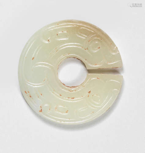 A RARE PALE GREEN JADE SLIT DISC, JUE Spring and Autumn Peri...