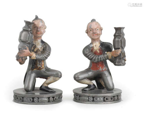AN UNUSUAL PAIR OF PAINTED PEWTER FIGURES OF EUROPEAN TRIBUT...
