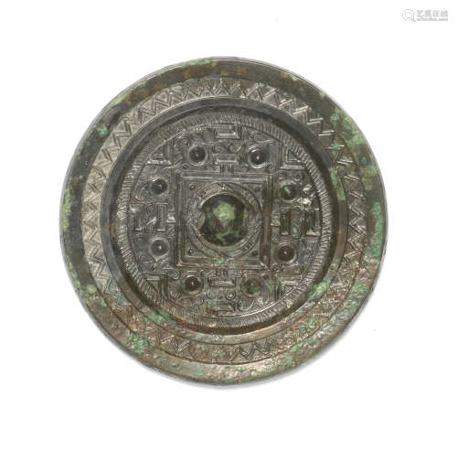 A BRONZE CIRCULAR 'TLV' MIRROR Han Dynasty