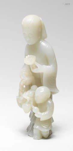 A RARE VERY PALE GREEN JADE 'LADY AND BOY' GROUP Kangxi