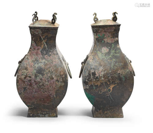 A PAIR OF ARCHAIC BRONZE RITUAL WINE VESSELS AND COVERS, FAN...
