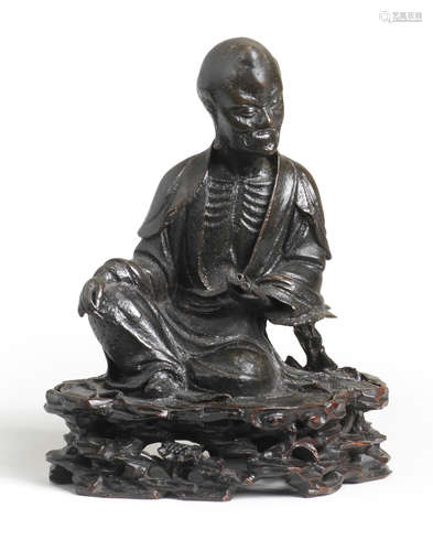 A BRONZE FIGURE OF AN EMACIATED LUOHAN Wen nan two-character...