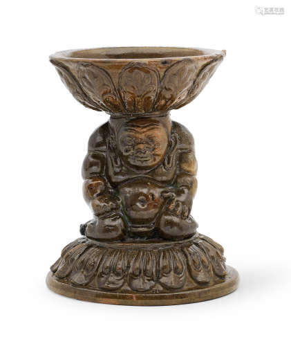 A RARE GREEN-GLAZED 'YAKSHA' LAMP Northern Qi Dynasty