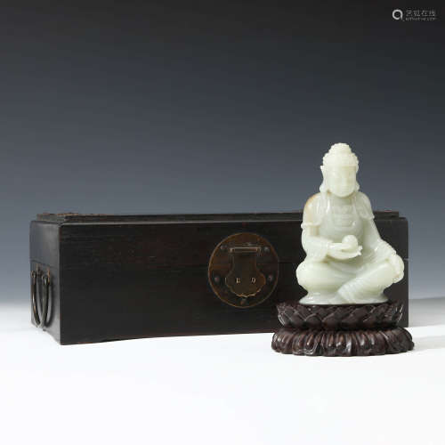 A Carved White Jade Figure Of Medicine Buddha