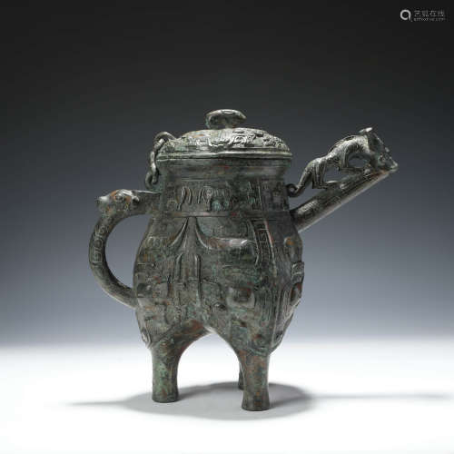 An Archaistic Bronze Beast Pattern Tripod Wine Vessel