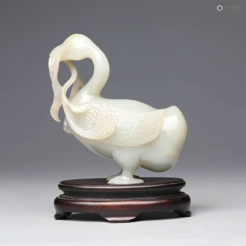 A Carved White Jade Duck Ornament With Stand