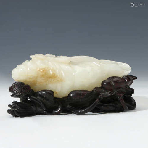 A Carved White Jade Conch Ornament With Stand