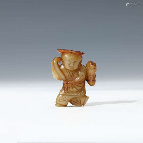 A Carved Yellow Jade Boy Ornament