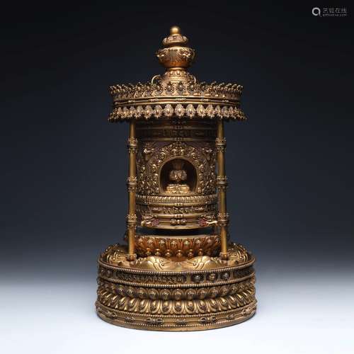 A Gilt-Bronze Prayer Wheel Buddha