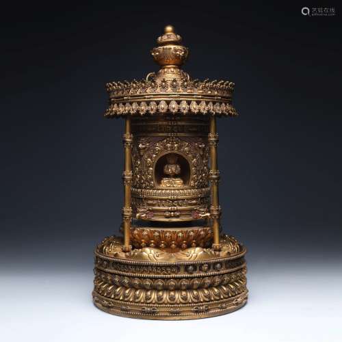 A Gilt-Bronze Prayer Wheel Buddha