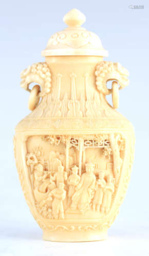 A CHINESE CHIEN LUNG IVORY SNUFF BOTTLE of oval form with li...