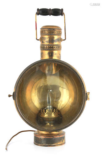 A LATE 19TH CENTURY BRASS CARRYING LAMP with folding handle ...