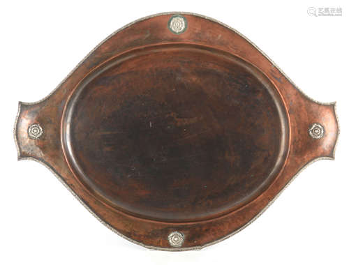 A 1920's A.E. JONES HAND BEATEN COPPER TRAY with silver roun...