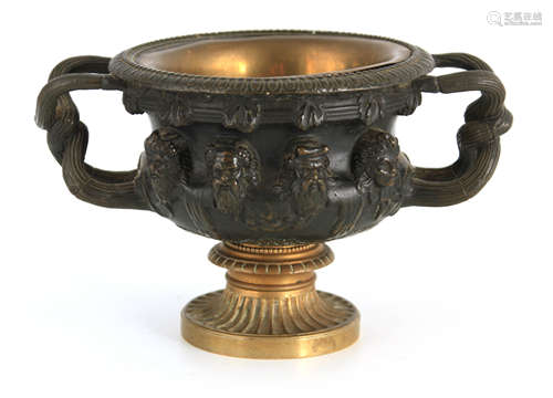 A 19TH CENTURY FRENCH BRONZE AND GILT BRONZE URN with relief...