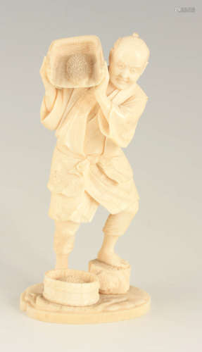 A 19TH CENTURY JAPANESE CARVED IVORY FIGURE of a standing ma...