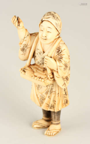 A 19TH CENTURY JAPANESE CARVED IVORY OKIMONO in bamboo decor...
