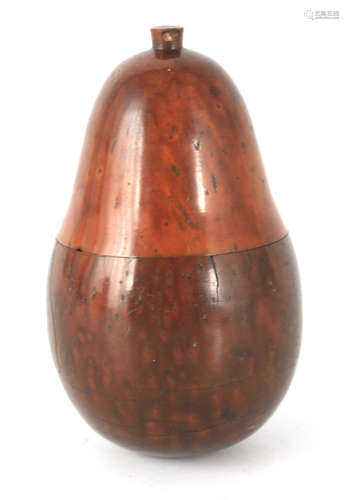 A 19TH CENTURY COQUILLA NUT NUTMEG GRATER FORMED AS A PEAR w...