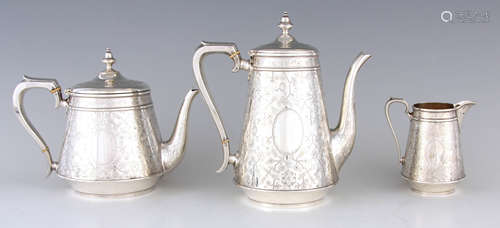 A VICTORIAN BRIGHT CUT ENGRAVED SILVER THREE-PIECE TEA & COF...