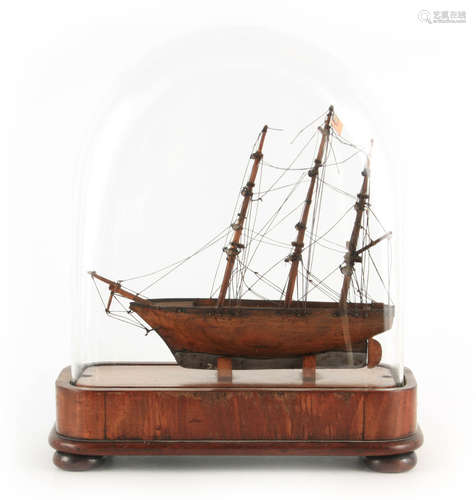 A SMALL 19TH CENTURY SHIPS MODEL UNDER GLASS DOME modelled a...