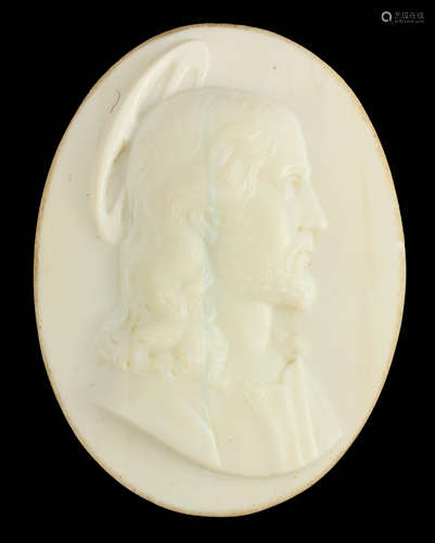 AN EARLY CARVED OPAQUE GLASS OVAL PORTRAIT OF CHRIST 8cm hig...