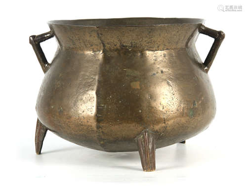 A 17TH CENTURY CAST BRONZE WEST COUNTRY TWO HANDLED CAULDRON...