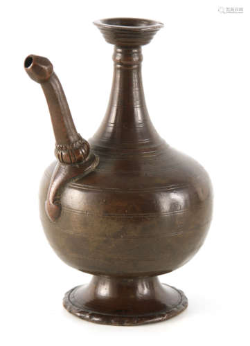 A 16TH CENTURY TIMURID PERSIAN BRONZE EWER of ribbed bulbous...