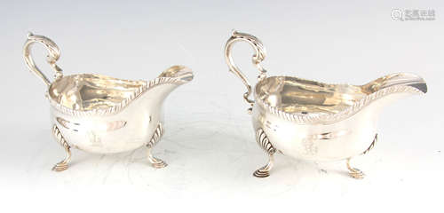 A PAIR OF GEORGE III SILVER SAUCEBOATS with raised gadrooned...