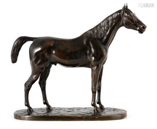 A 19TH CENTURY PATINATED BRONZE SCULPTURE OF A STANDING HORS...