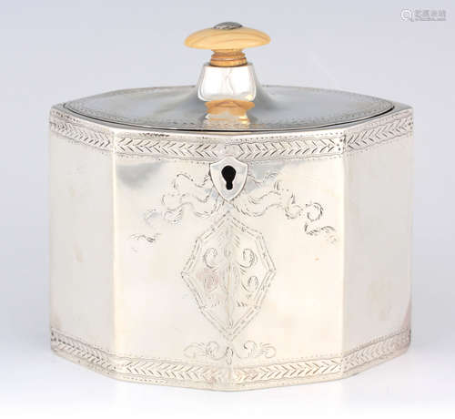 A GEORGE III PANELLED OVAL SILVER TEA CADDY with oval ivory ...