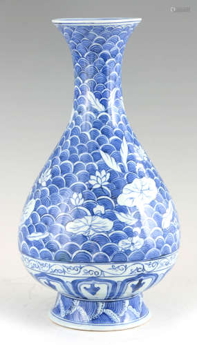 A CHINESE PORCELAIN BLUE AND WHITE VASE with flared neck and...