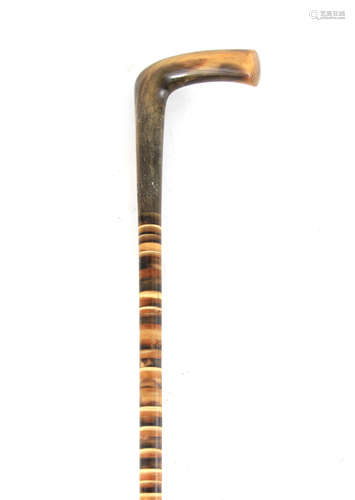 A SECTIONAL HORN WALKING STICK WITH RHINO HORN HANDLE 84cm o...