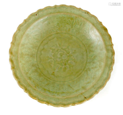 AN EARLY CHINESE SCALLOPED EDGE CELADON SHALLOW DISH with fl...