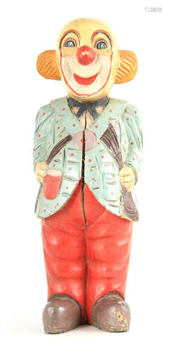 A CARVED PAINTED WOOD SCULPTURE OF A CLOWN decorated in poly...