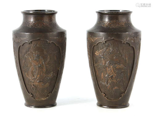 A PAIR OF JAPANESE BRONZE WHITE METAL PANELLED VASES with fi...