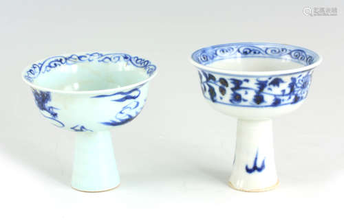 TWO CHINESE PORCELAIN BLUE AND WHITE STEM CUPS one decorated...
