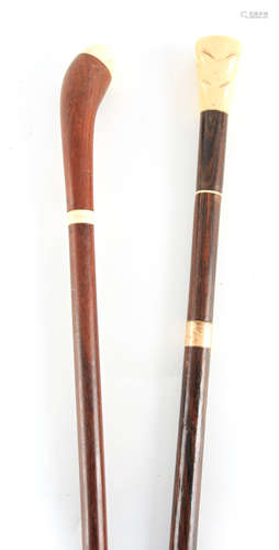 TWO 19TH CENTURY IVORY MOUNTED WALKING STICKS one with a Ros...