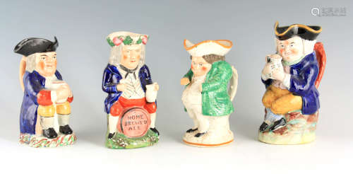 A GROUP OF THREE COLOURFUL SEATED STAFFORDSHIRE TOBY JUGS ea...