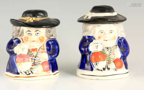 A PAIR OF COLOURFUL SEATED TOBY FIGURE LIDDED JARS 12.5cm hi...