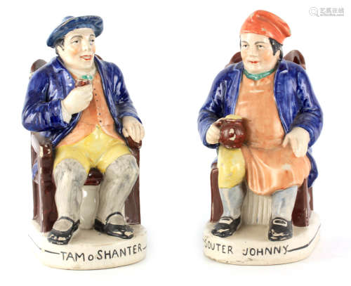 A PAIR OF COLOURFUL SEATED STAFFORDSHIRE TOBY JUGS depicting...